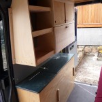 Cabinets and countertops in "Dudley" DIY Sprinter conversion
