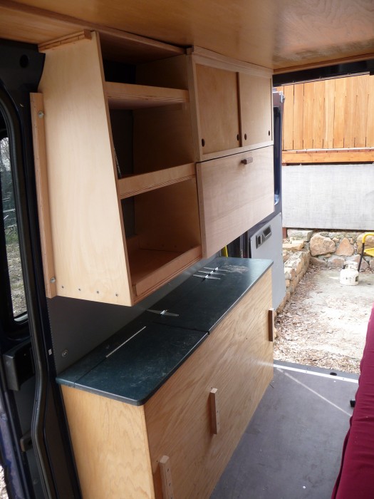 Cabinets and countertops in "Dudley" DIY Sprinter conversion