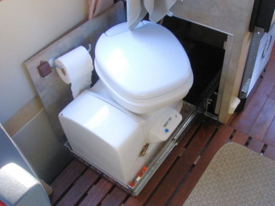 Thetford cassette toilet on pull-out drawer in Sprinter camper